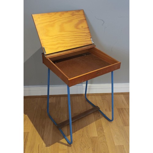 55 - A child's Tri-ang writing desk, pine with hinged top, on painted metal legs, blue, 50cm x 68cm x 42c... 