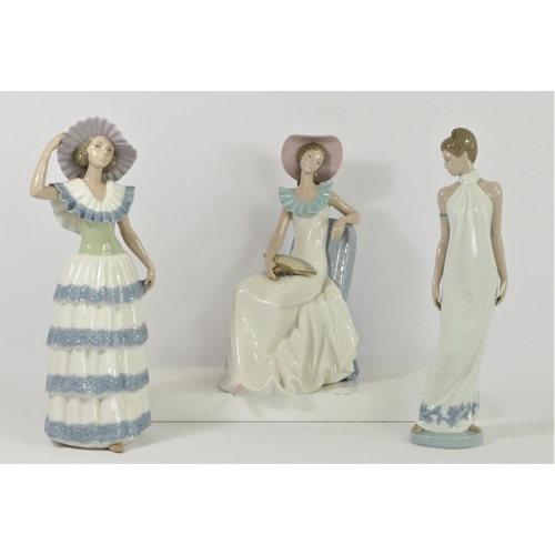 Three Nao by Lladro figurines of ladies to include, Lady with Fan