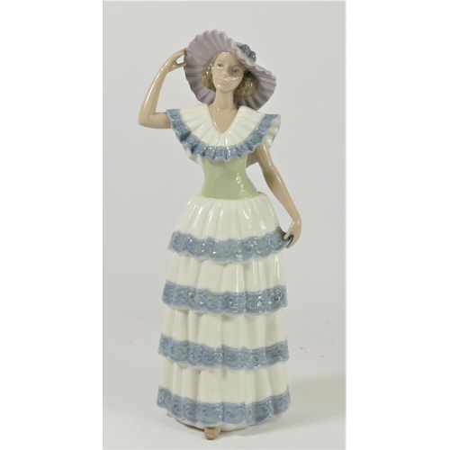 Three Nao by Lladro figurines of ladies to include, Lady with Fan