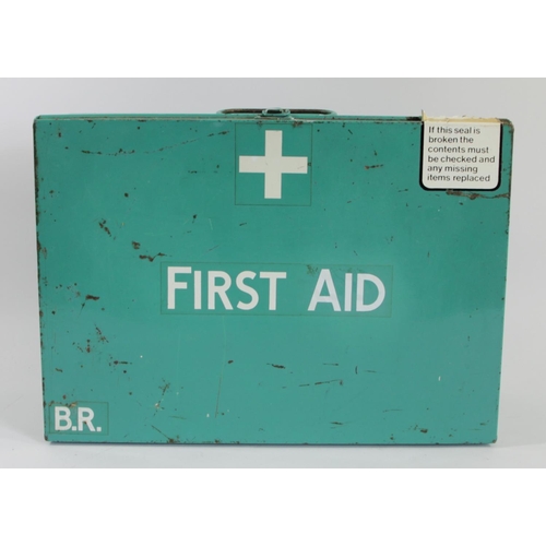 64 - A B.R green first aid tin with numerous contents, predominantly bandages and dressings.