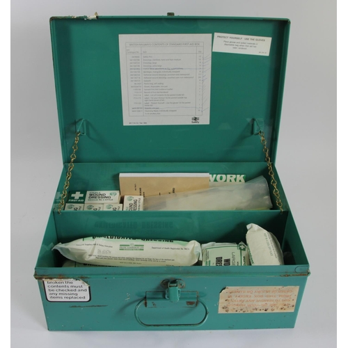 64 - A B.R green first aid tin with numerous contents, predominantly bandages and dressings.