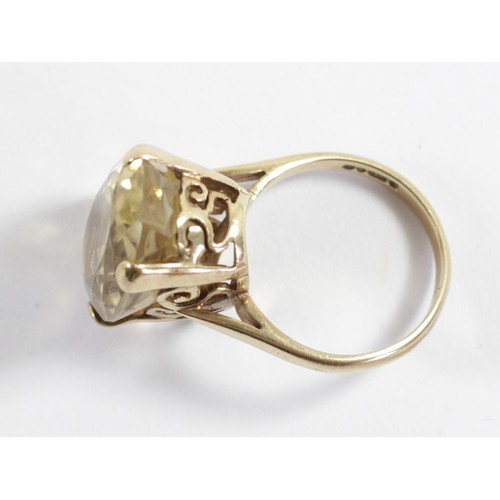 164 - A 9ct gold and citrine dress ring, 18 x 13mm, L, 6gm.