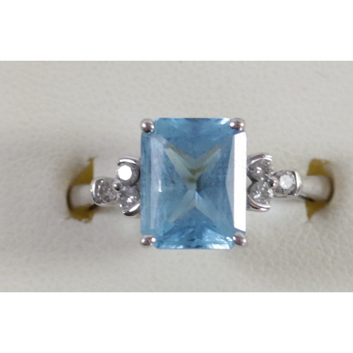 168 - A 9ct white gold blue topaz and diamond dress ring, 10 x 8mm, O, 2.8gm