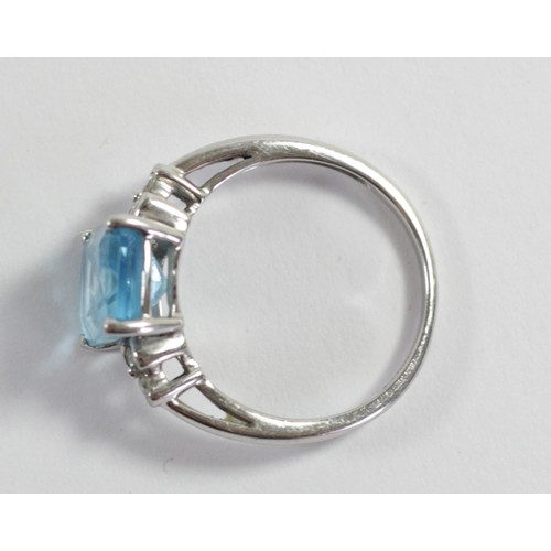 168 - A 9ct white gold blue topaz and diamond dress ring, 10 x 8mm, O, 2.8gm