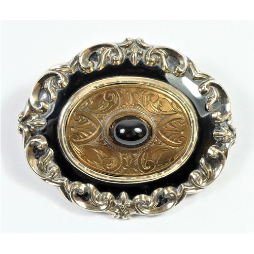 173 - A Victorian gold, enamel and cabochon garnet mourning brooch, inscribed 