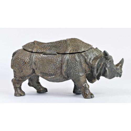 185 - An early 20th century cold painted metal model of a Rhinoceros, the back opening to reveal two inkwe... 