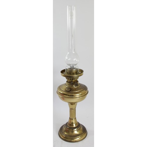 191 - A brass oil lamp, with etched ruby glass shade, Sun clear glass funnel, 62cm