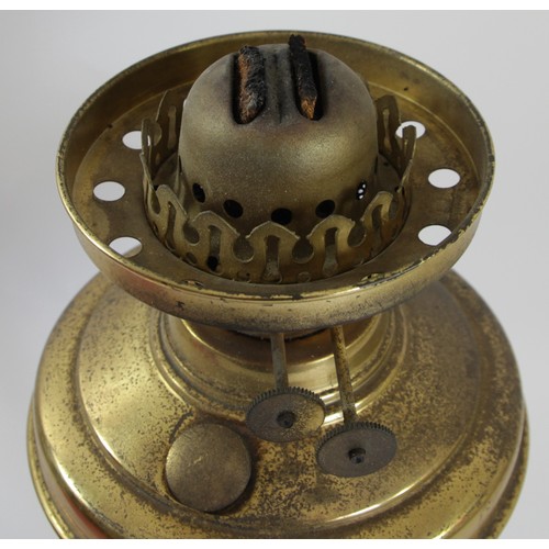 191 - A brass oil lamp, with etched ruby glass shade, Sun clear glass funnel, 62cm