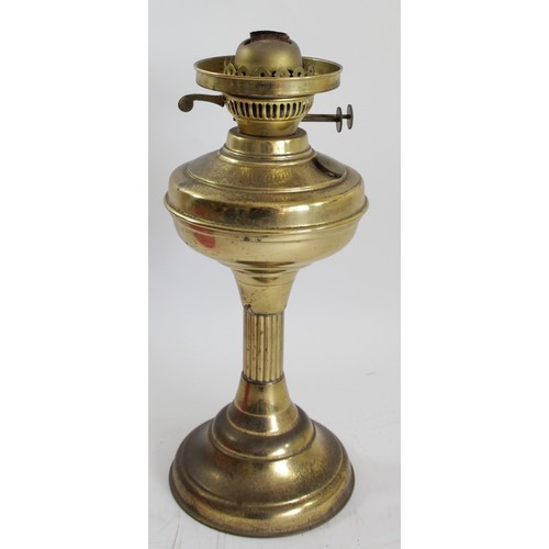 191 - A brass oil lamp, with etched ruby glass shade, Sun clear glass funnel, 62cm