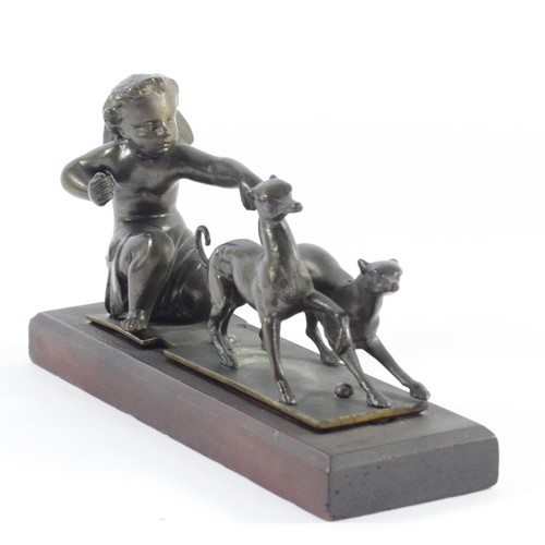 211 - A bronze group of a winged cherub being pulled by a pair of greyhounds, late 19th century, 19cm, lat... 