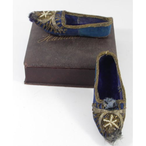 212 - A pair of 19th century child's shoes, blue velvet with wirework and bead decoration, 17.5cm