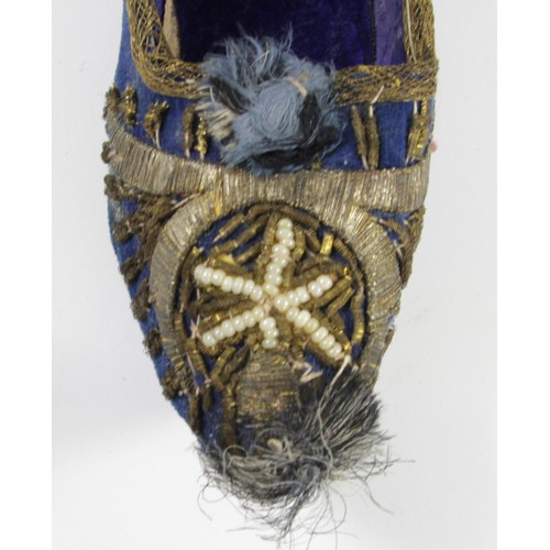 212 - A pair of 19th century child's shoes, blue velvet with wirework and bead decoration, 17.5cm