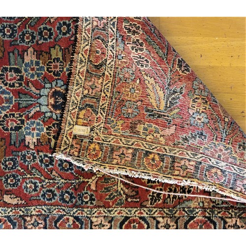 214 - A Persian Sarouk runner with multicoloured floral decorations, 280 x 80 cm