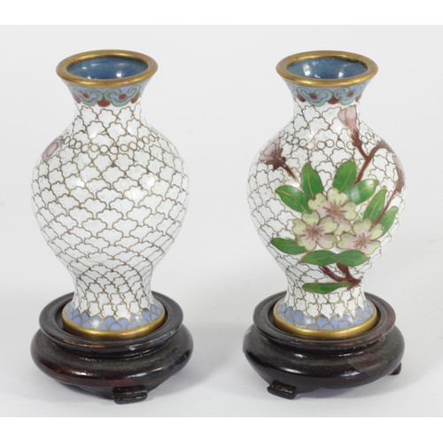 275 - A Japanese pair of cloisonne baluster vases, decorated with a floral spay, 8cm, together with hardwo... 