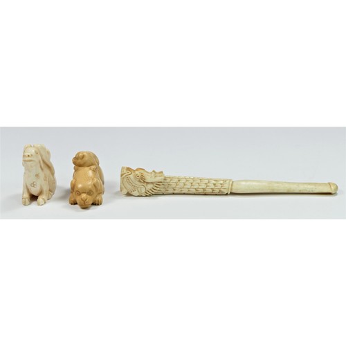 282 - A carved ivory netsuke depicting a puppy on its mothers back, 4cm, another of a rabbit with antlers,... 