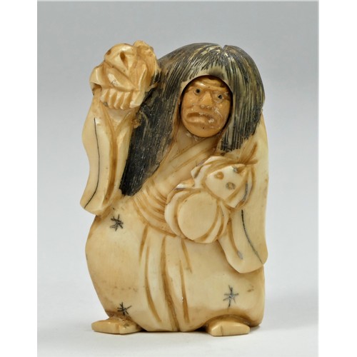 283 - A carved ivory netsuke of a man with a spinning head, signed, 5cm