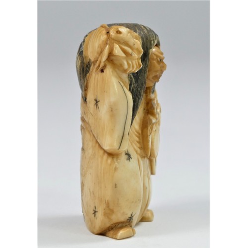 283 - A carved ivory netsuke of a man with a spinning head, signed, 5cm