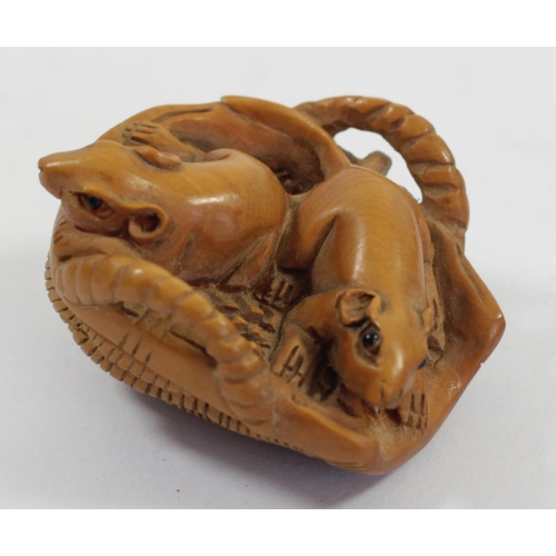 285 - A Japanese wood netsuke of two mice in a basket, signed, 4cm and three other wooden netsuke of mice,... 