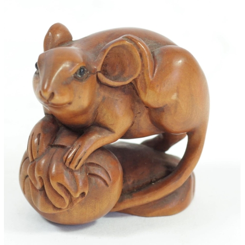 285 - A Japanese wood netsuke of two mice in a basket, signed, 4cm and three other wooden netsuke of mice,... 