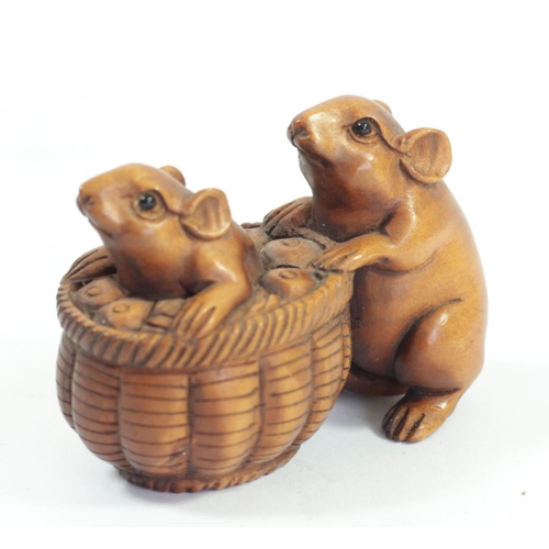 286 - A Japanese wood netsuke of two mice on a mushroom, signed, 4cm and four other wooden netsuke of mice... 