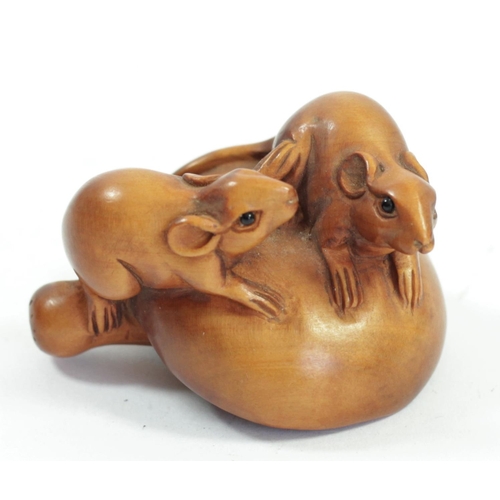 286 - A Japanese wood netsuke of two mice on a mushroom, signed, 4cm and four other wooden netsuke of mice... 