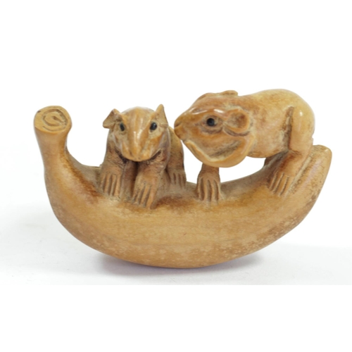 286 - A Japanese wood netsuke of two mice on a mushroom, signed, 4cm and four other wooden netsuke of mice... 