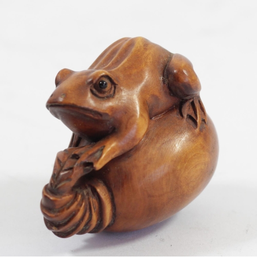 288 - A Japanese wood netsuke of three frogs in a bucket, signed, 5.5cm, three other wooden netsuke of fro... 