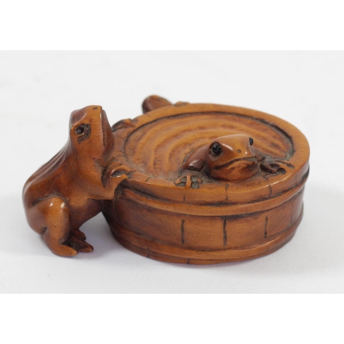 288 - A Japanese wood netsuke of three frogs in a bucket, signed, 5.5cm, three other wooden netsuke of fro... 