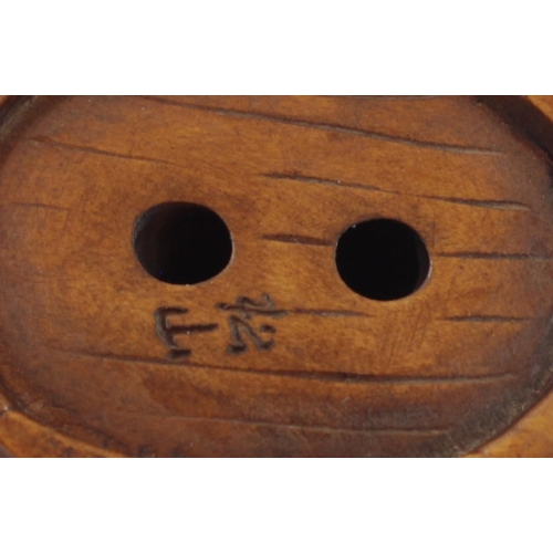 288 - A Japanese wood netsuke of three frogs in a bucket, signed, 5.5cm, three other wooden netsuke of fro... 