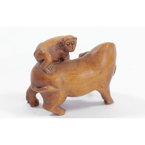 290 - A Japanese wood netsuke of a monkey on a pig, signed, 5cm, a monkey on a water buffalo, signed and t... 