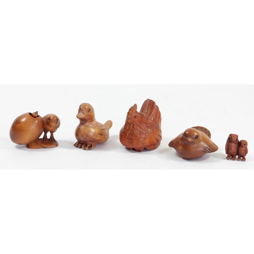 294 - A Japanese wood netsuke of a chick by an egg with another inside, signed, 5cm, and four other wooden... 