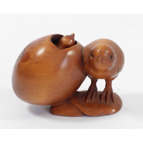 294 - A Japanese wood netsuke of a chick by an egg with another inside, signed, 5cm, and four other wooden... 