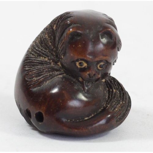 295 - A Japanese wood netsuke of an octopus fishing fish, signed, small loses, 4cm, a coiled snake, a dog ... 