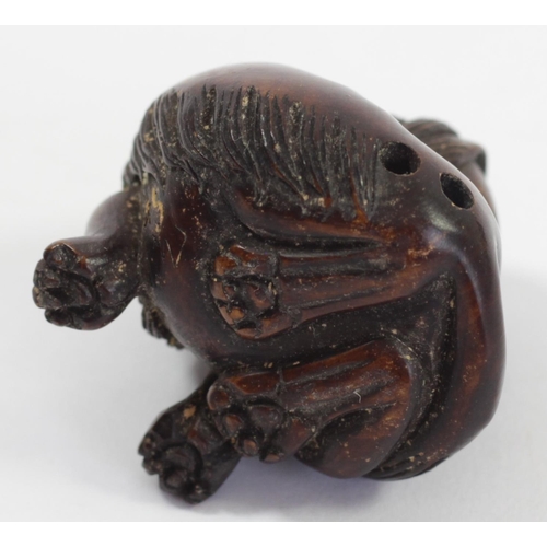 295 - A Japanese wood netsuke of an octopus fishing fish, signed, small loses, 4cm, a coiled snake, a dog ... 