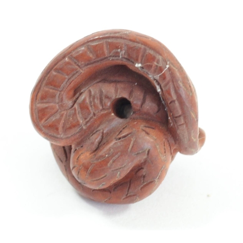 295 - A Japanese wood netsuke of an octopus fishing fish, signed, small loses, 4cm, a coiled snake, a dog ... 