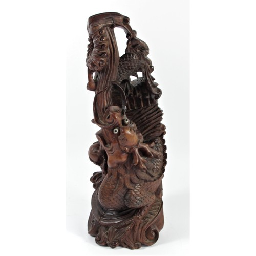 298 - A Chinese carved rootwood statue, depicting a dragon chasing the sacred pearl, 35cm