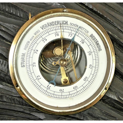 299 - Veranderlich, a Black Forest wall aneroid barometer, the ornately carved case with stag in a forest ... 