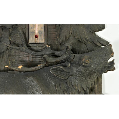 299 - Veranderlich, a Black Forest wall aneroid barometer, the ornately carved case with stag in a forest ... 