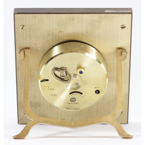 305 - Gucci, a gilt brass and black enamel 8 day manual wind alarm clock, easel stand, lacking winder and ... 