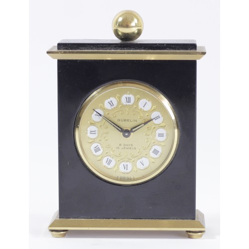 306 - Gubelin, a gilt brass and black lacquer 8 day manual wind alarm clock, numbered 665387, 9.5 x 7cm.