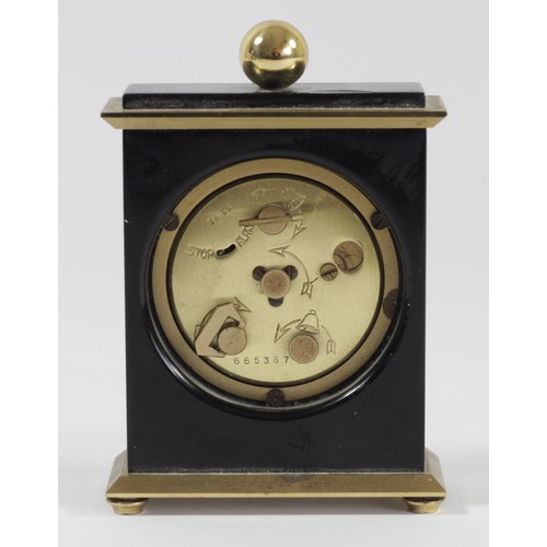 306 - Gubelin, a gilt brass and black lacquer 8 day manual wind alarm clock, numbered 665387, 9.5 x 7cm.