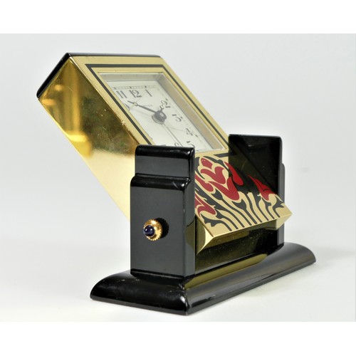 303 - Cartier, an Art Deco style gilt brass and lacquer adjustable quartz alarm clock, numbered 890701551,... 