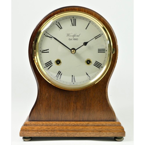 317 - Woodford, a mahogany balloon mantle clock, the white enamel dial signed, the 8 day movement by Franz... 