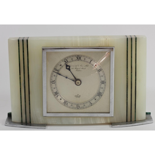 319 - Elliot for Garrard & Co. Ltd., London, a white onyx and malachite presentation mantle clock, the sil... 