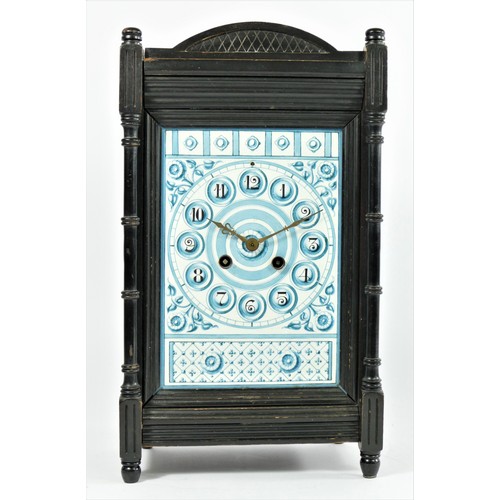 321 - An Aesthetic Movement mantle clock, c.1880/90, the pottery tile dial mounted in an ebonised case, th... 