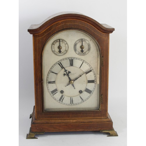 322 - Russells Ltd., Liverpool, an early 20th century oak cased mantel clock, the silvered dial with chime... 