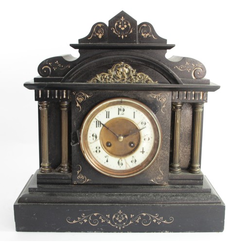 324 - A late 19th century French black slate mantel clock, the ivorine dial to a signed movement, striking... 