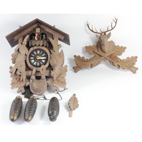 327 - Albert Schwab, Karlsrune, a Black Forest musical cuckoo clock, the case with revolving characters, b... 