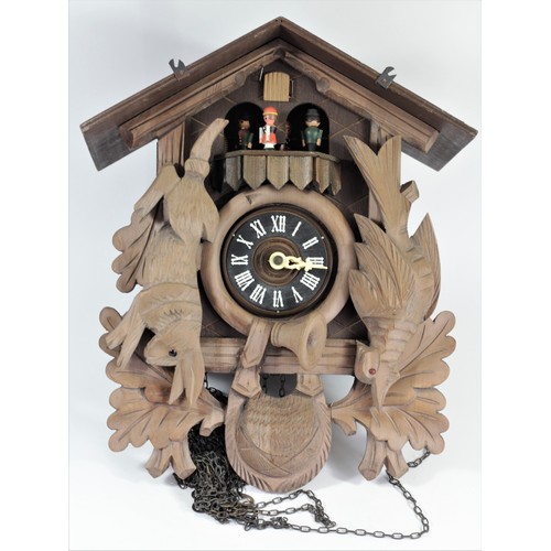 327 - Albert Schwab, Karlsrune, a Black Forest musical cuckoo clock, the case with revolving characters, b... 