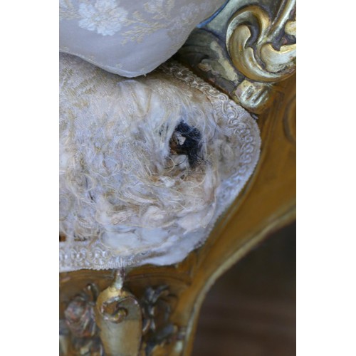 353 - A Louis XV style mahogany framed wing back armchair, with carved giltwood frame, sprung upholstered,... 